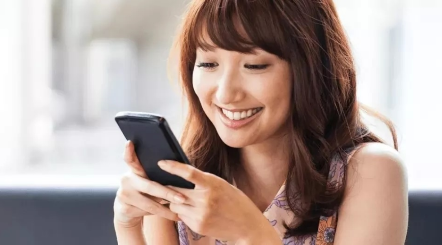 Woman checking her bonus checking account on the Civic mobile app.