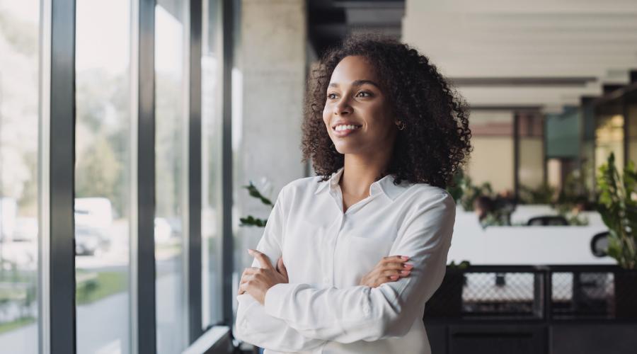 Small business owner looking confident after placing a online order with her Civic Business Rewards Credit Card.