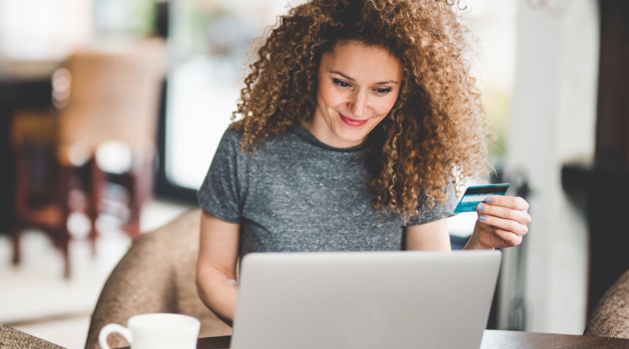 Woman doing some online shopping with her Civic Rewards Credit Card.