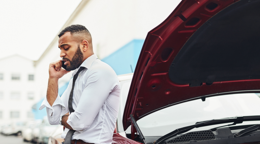 A man calls for help while stranded on the side of the road, knowing he can count on the Civic Emergency Loan to get him back behind the wheel.