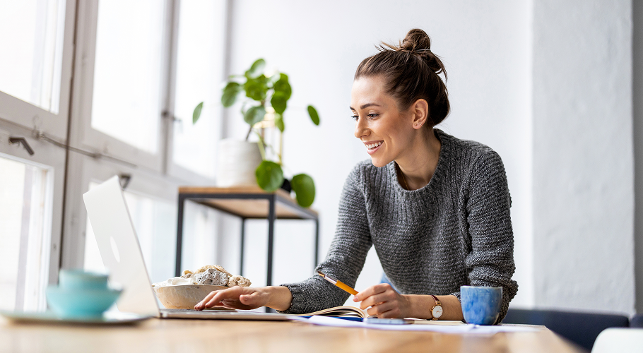 Women on a computer smiling