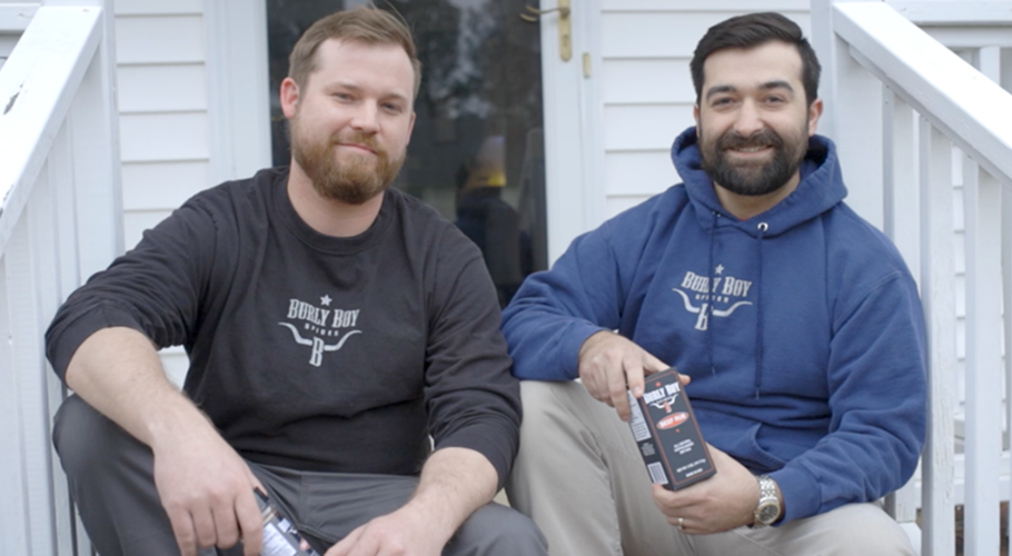two men sitting on a porch