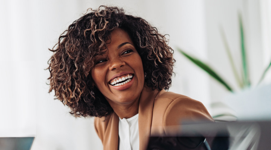 A smiling woman, happy with her decision to join Civic by opening a Select Savings Account.