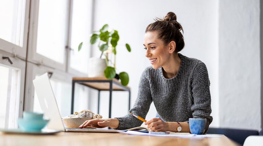 Women on a computer smiling