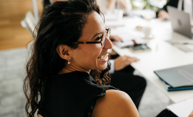 Young business woman in a meeting discussing Civc's Business Line of Credit.