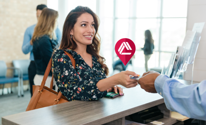 Civic member depositing cash in a Co-op shared Branch location near her home.