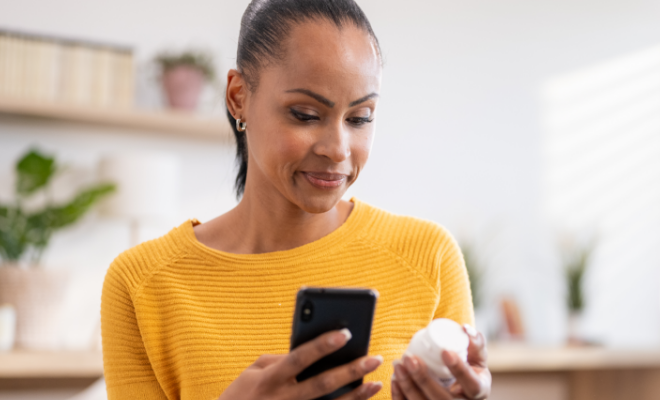A woman calls her pharmacy to refill her prescription, using her Civic Health Savings Account to manage the cost.