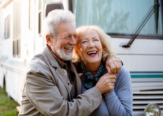 Happy couple in front of RV