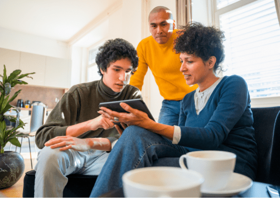 family showing son how to check his accounts