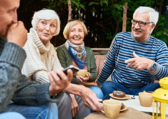A group of older people enjoying coffee during their retirement.
